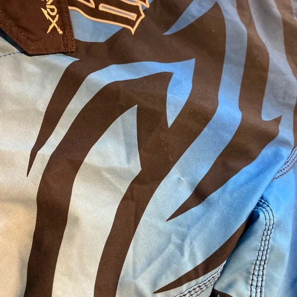 Billabong Blue and Black Board Shorts with Tribal Patterns - Picture 4 of 5